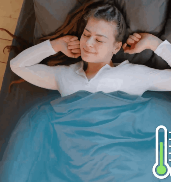 Woman sleeping comfortably under Miracle Sheets cooling bedding