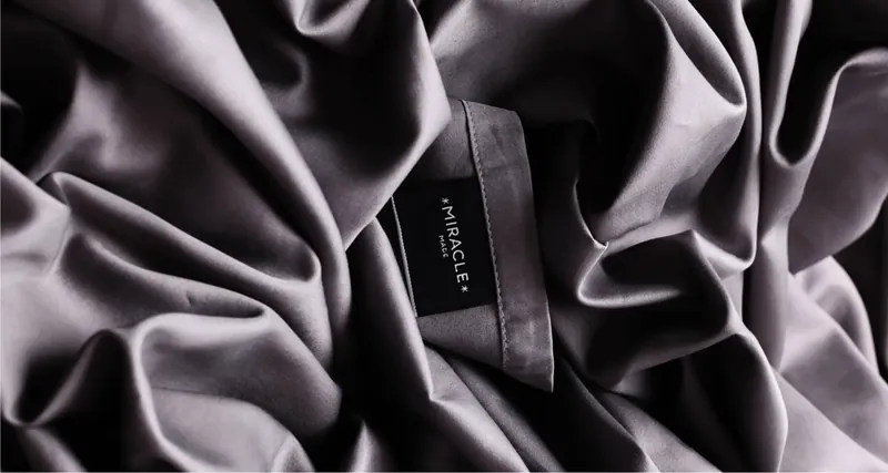Close-up of Miracle Sheets gray fabric with label